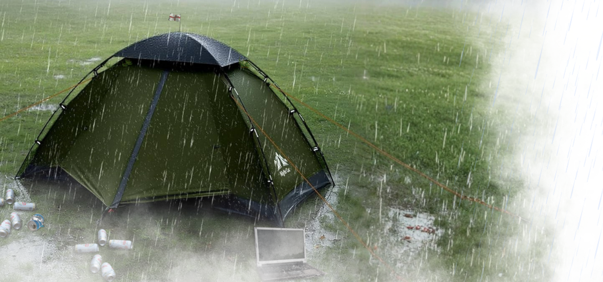 A lone tent sits in a rainy waterlogged field