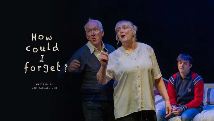 A man and woman sing on a stage, the words 'how could I forget, written by Joe Carnall Jnr' are written to one side.